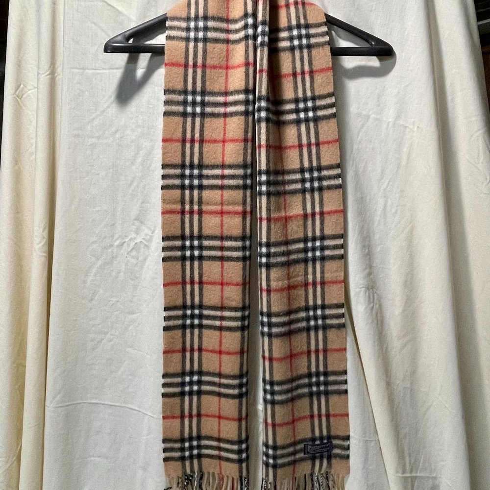 Burberry Scarf Never Worn in original plastic sleeve - 76 x 12 (incl fringe).